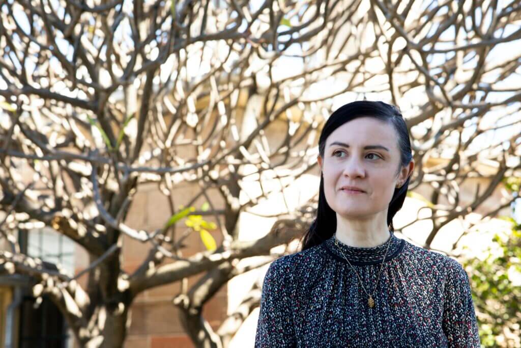 Potrait of Vanessa Berry standing in front of trees.